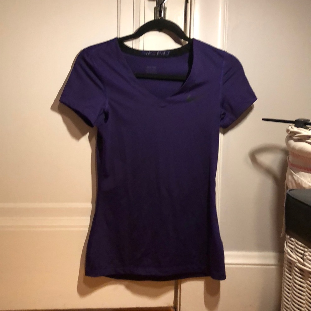 Purple Nike Pro athletic top.